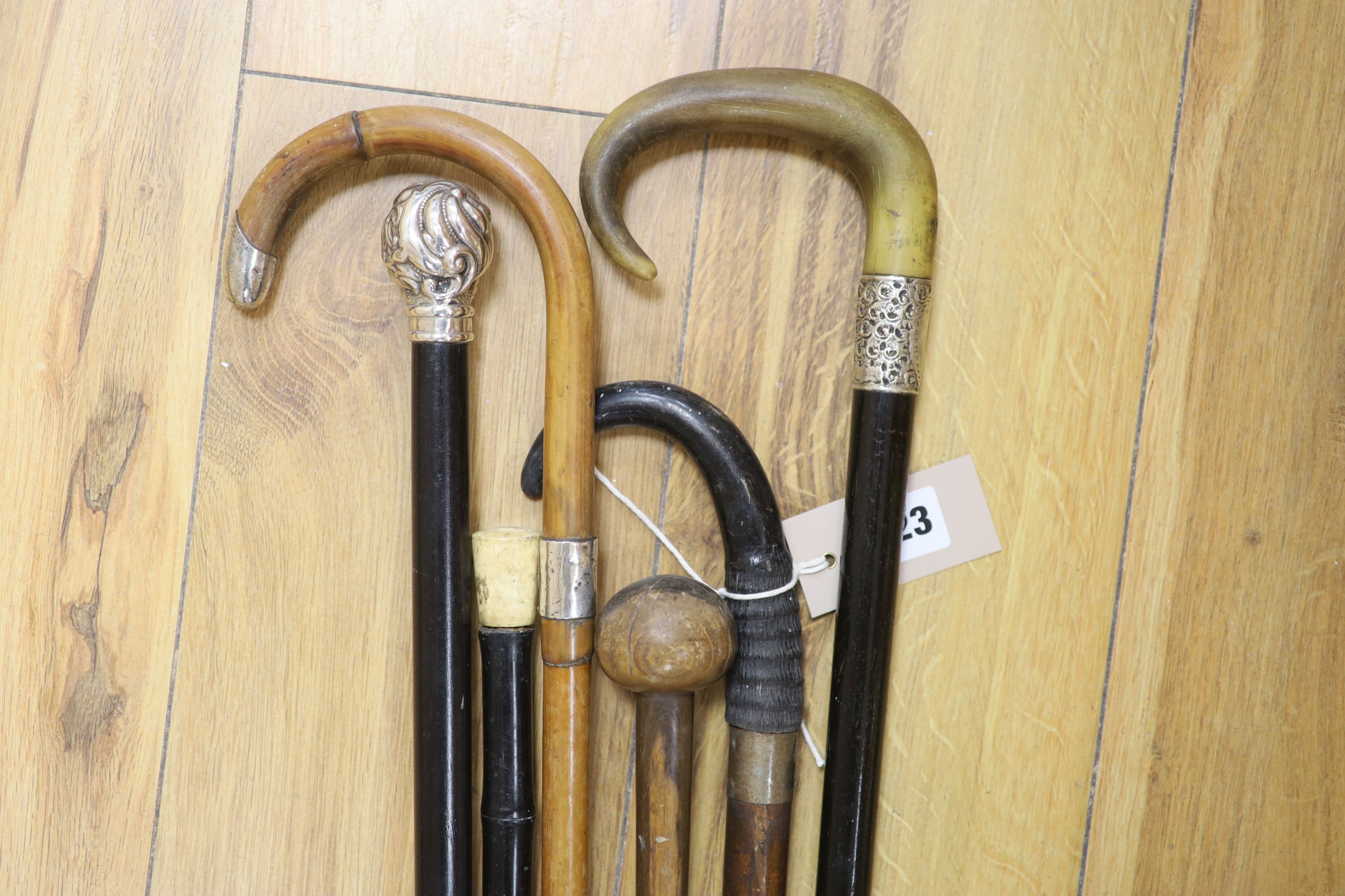 Three silver-mounted sticks and canes and three others